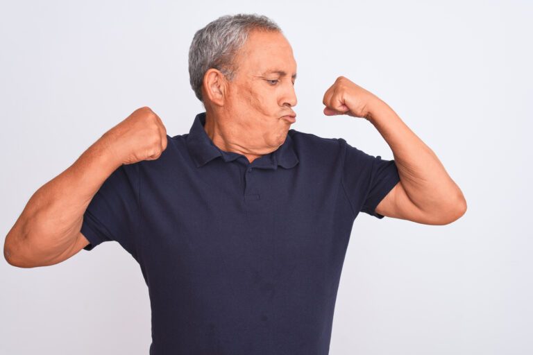 Does Finasteride Lower Testosterone? What You Need To Know 5 Senior man flexing his muscles