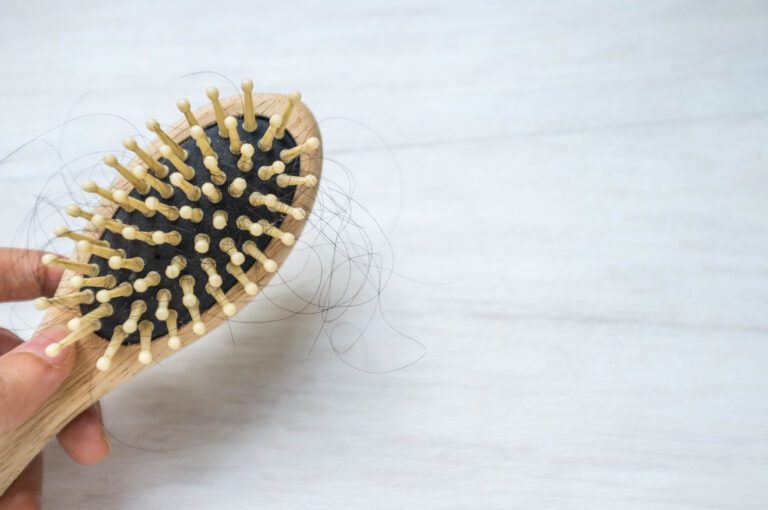 Finasteride Shedding: Why It Happens & How Long It Lasts 5 A comb with hair