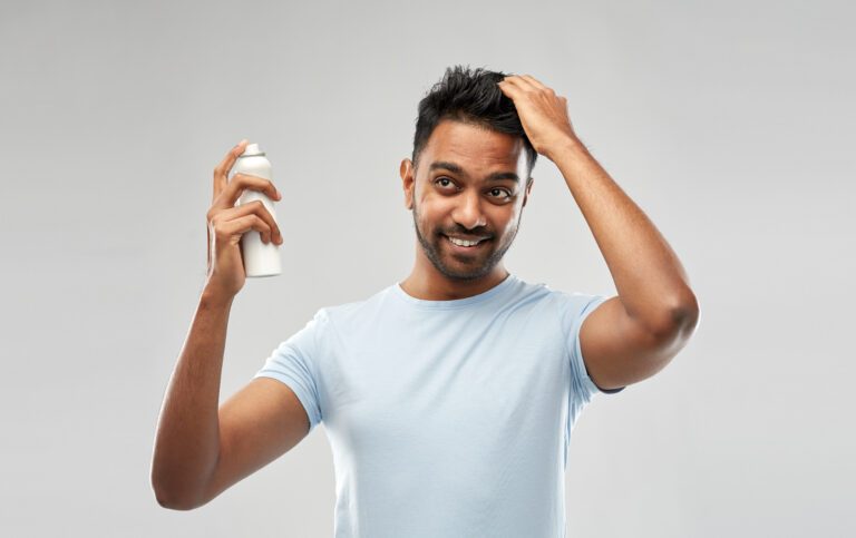 Minoxidil Foam Vs. Liquid: Which Is Better For Hair Loss? 3 Man with hair loss product